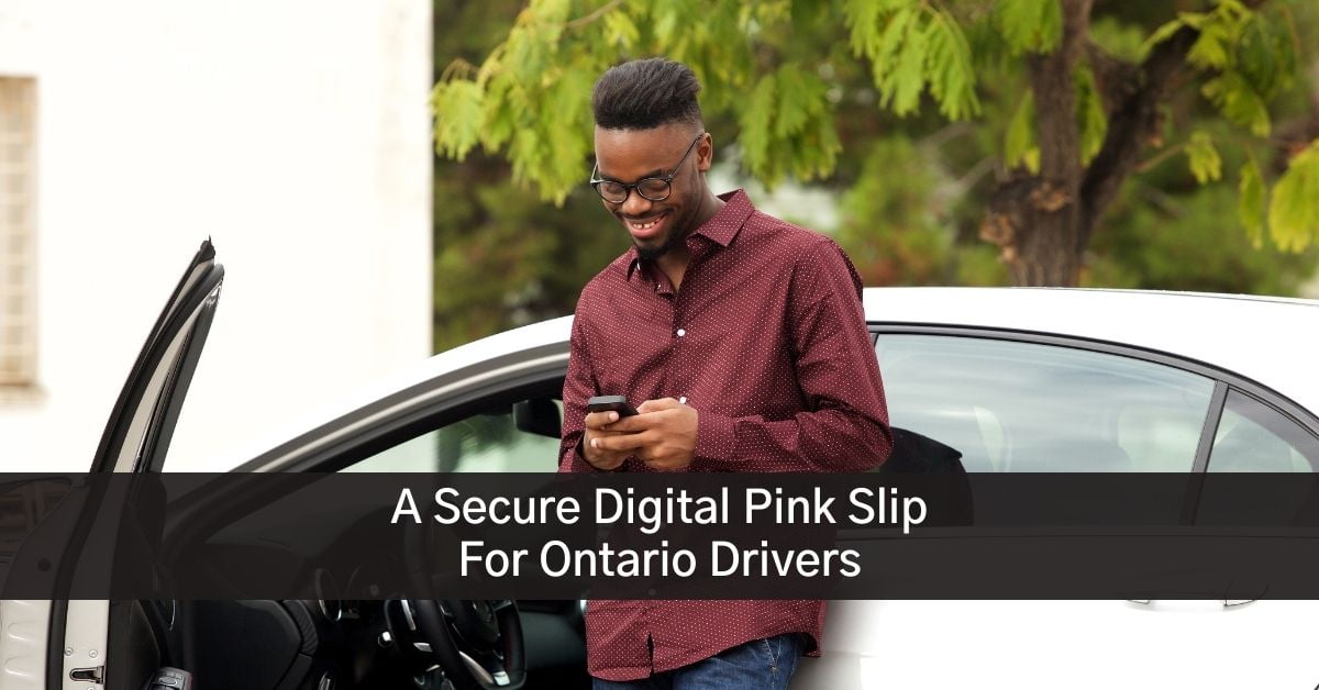 Man looking at his digital pink slip on his Bryson mobile app standing outside his car in Ontario
